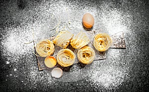 Pasta background. Cooking homemade pasta with egg and flour.