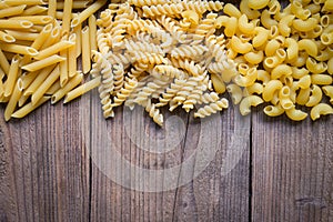 Pasta background, raw macaroni texture background, penne pasta and spiral pasta uncooked delicious pasta for cooking food