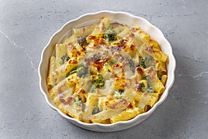 Pasta baked with broccoli and chicken. Broccoli, cheese and gratin sauce on baked penne pasta