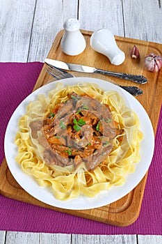Pasta with beef stroganoff on plate