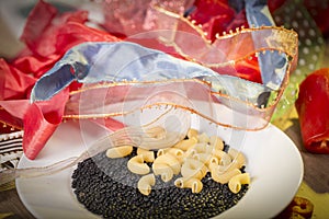 Pasta and black beluga lentils and a pile of gift ribbons