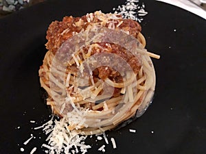 Pasta Bolognese with cheese . Close up.