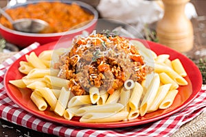 Pasta bolognese. Pasta served with a sauce of ground beef meat, tomato, onion, carrot and thyme