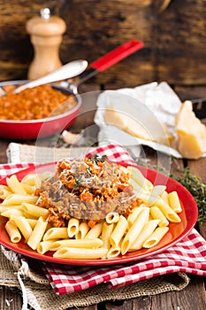 Pasta bolognese. Pasta served with a sauce of ground beef meat, tomato, onion, carrot and thyme