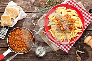 Pasta bolognese. Pasta served with a sauce of ground beef meat, tomato, onion, carrot and thyme