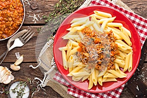 Pasta bolognese. Pasta served with a sauce of ground beef meat, tomato, onion, carrot and thyme