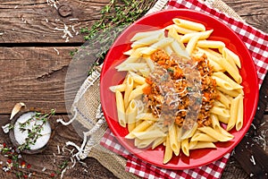 Pasta bolognese. Pasta served with a sauce of ground beef meat, tomato, onion, carrot and thyme