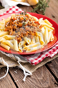 Pasta bolognese. Pasta served with a sauce of ground beef meat, tomato, onion, carrot and thyme