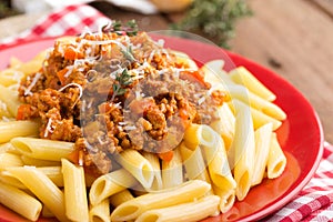 Pasta bolognese. Spaghetti served with a sauce of ground beef meat, tomato, onion, carrot and thyme