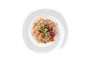 Pasta Bolognese with tomato sauce, minced beef, garlic, basil on white plate. Spaghetti isolated on white background