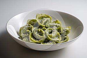 Pasta Bowl of green ravioli with parmesan