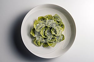 Pasta Bowl of green ravioli with parmesan