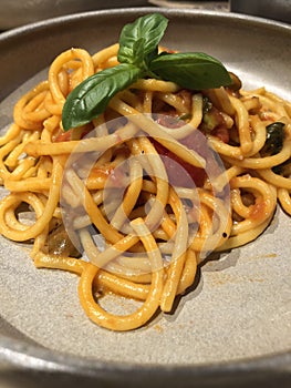 Pasta with capers, tomatoes and basil