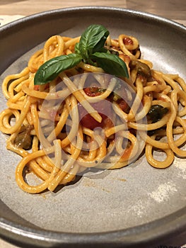 Pasta with capers, tomatoes and basil