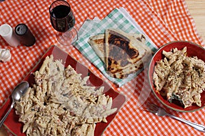 Pasta Carbonara With Italian Flat Bread on Buffet Table