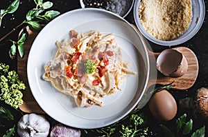 Pasta Carbonara in white dish, surround fresh ingredient photo
