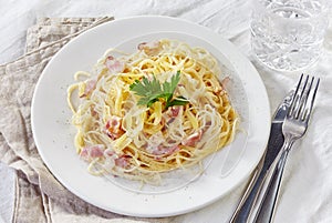 Pasta carbonara on white plate