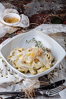 Pasta with carbonaria, spaghetti with hard parmesan and cheese-sauce. Traditional Italian cuisine. Pasta al-Carbonara