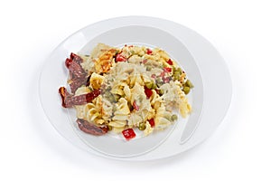 Pasta casserole with supplemented sun-dried tomatoes on white background