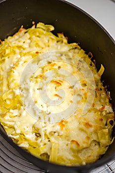 Pasta with cheese and butter in castiron pot