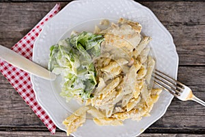 Pasta with cheese and salad