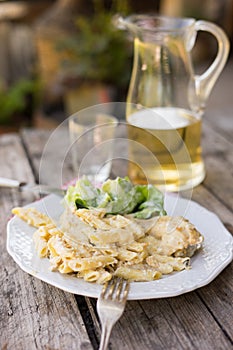 Pasta with cheese and salad