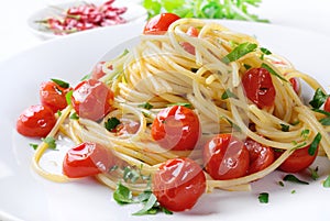 Pasta with cherry tomatoes, garlic, oil, chilli pepper and parsley