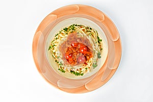 Pasta with cherry tomatoes, zucchini and letcho on a white background