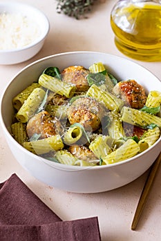 Pasta with chicken meatballs, basil and parmesan. Italian food