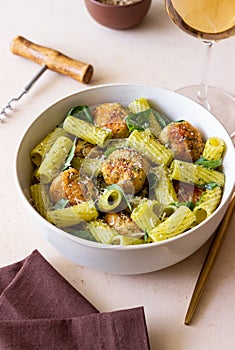 Pasta with chicken meatballs, basil and parmesan. Italian food