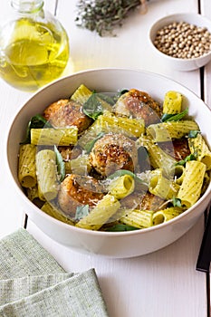 Pasta with chicken meatballs, basil and parmesan. Italian food