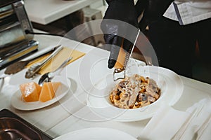 Pasta with chicken in a plate on white table