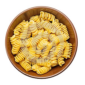 Pasta close-up. Fusilli spirale in a bowl, isolated on white background. Full depth of field. File contains clipping path photo