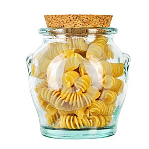Pasta close-up. Fusilli spirale in a glass jar, isolated on white background. Full depth of field photo
