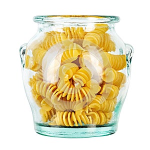 Pasta close-up. Fusilli spirale in a glass jar, isolated on white background. Full depth of field photo