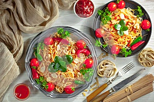 Pasta in a composition with accessories on the table, on an old background.