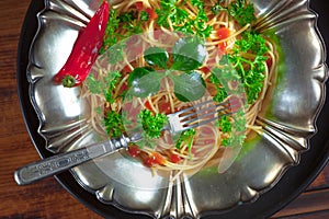 Pasta in a composition with accessories on the table, on an old background.