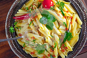 Pasta in a composition with accessories on the table, on an old background.