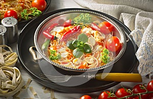 Pasta in a composition with accessories on the table, on an old background.