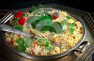 Pasta in a composition with accessories on the table, on an old background.