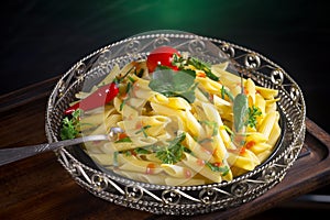 Pasta in a composition with accessories on the table, on an old background.