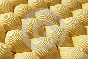Pasta conchiglioni or conchiglie pattern. Abstract creative food background