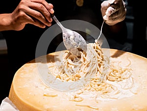 Pasta cooking in cheese bowl