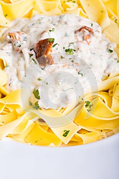 Pasta with cream sauce with chanterelle