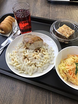 Pasta with cutlet and cabbage salad