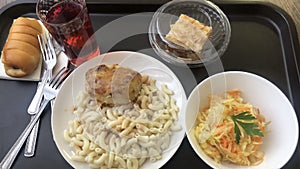 Pasta with cutlet and cabbage salad