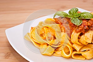 Pasta decorated with basil leaves