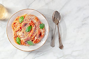 Pasta dinner. Spaghetti with tomato sauce, Parmesan cheese and basil