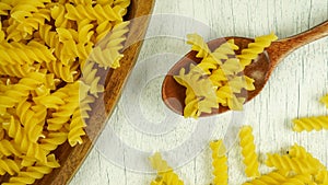 pasta in a dish dry appetizing spiral macaroni in the kitchen