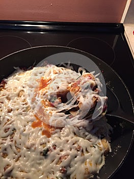 A pasta dish sitting on a stove top